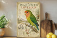A vintage-style poster of a peach-faced lovebird, featuring a detailed illustration of the bird perched on a branch with other birds and plants. The poster is displayed on a shelf next to a wooden cutting board and a potted plant.
