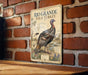 A vintage-style metal sign featuring an illustration of a wild turkey against a brick wall background.