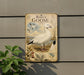 A vintage-style metal plaque depicting a white goose, with text and illustrations related to the goose's species.