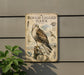 a metal plaque with an illustration of a rough-legged hawk, mounted on a wall.