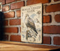 a vintage-style metal sign with illustrations and text, mounted on a brick wall.