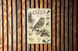 a poster or informational display about the Ruby-Crowned Kinglet, a small bird native to North America. The poster includes a detailed illustration of the bird and provides information about its habitat, size, and behavior.