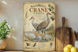 a vintage-style illustration of sandhill cranes, with a wooden board displaying the text "Sandhill Crane Family" and an illustration of the cranes in a natural setting.