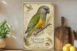 a decorative sign with a colorful illustration of a green and yellow parrot, placed on a wooden surface next to a potted plant and a wooden cutting board.