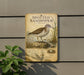 a sign for the spotted sandpiper, which is a bird with a brown and white coloration.