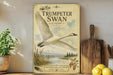 a vintage-style poster of a swan in flight, with a scenic landscape in the background.
