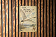 a poster of a swan in flight, mounted on a wooden wall.