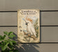 A vintage-style metal sign featuring an illustration of a cockatoo, with text and decorative elements, mounted on a wall next to a plant.