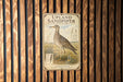 A vintage-style metal sign with an illustration of a bird, mounted on a wooden wall.