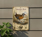 a vintage-style metal sign with a bird illustration, mounted on a wall next to a plant.