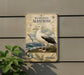 a vintage-style metal sign with an illustration of a seagull, mounted on a wall.