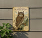 a metal sign with an illustration of a Whiskered Screech- Owl, which is a type of owl. The sign is mounted on a wall, and there is a plant to the left of the sign.
