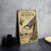 A vintage-style book or magazine cover titled "WHITE-BREasted NUTHATCH" with illustrations of a white-breasted nuthatch and pine cones.