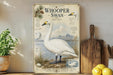 a vintage-style illustration of a swan, with a wooden paddle and a potted plant in the background.