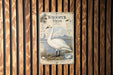 A vintage-style poster of a swan is displayed on a wooden wall, featuring illustrations of the swan and its natural habitat.