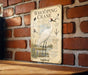 A poster of a Whooping Crane is displayed on a brick wall, featuring illustrations and text about the bird.