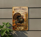 A metal sign with a turkey illustration and the text "Wild Turkey in Autumn Forest" is displayed on a wall, with a plant visible to the left.