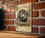A vintage-style metal sign featuring a detailed illustration of a wild turkey, mounted on a brick wall.