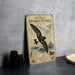 A vintage-style metal sign with a bird illustration and text, placed on a dark surface next to some black camera lenses.