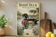 A vintage-style poster of a wood duck swimming in a pond, surrounded by pine trees and other natural elements, is displayed on a wall next to a wooden cutting board and some potted plants.