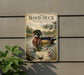 A vintage-style sign featuring a wood duck swimming in a pond, surrounded by lush greenery and pine trees.