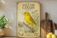 A vintage-style poster of a yellow canary is displayed on a wall, surrounded by kitchen utensils and a potted plant.