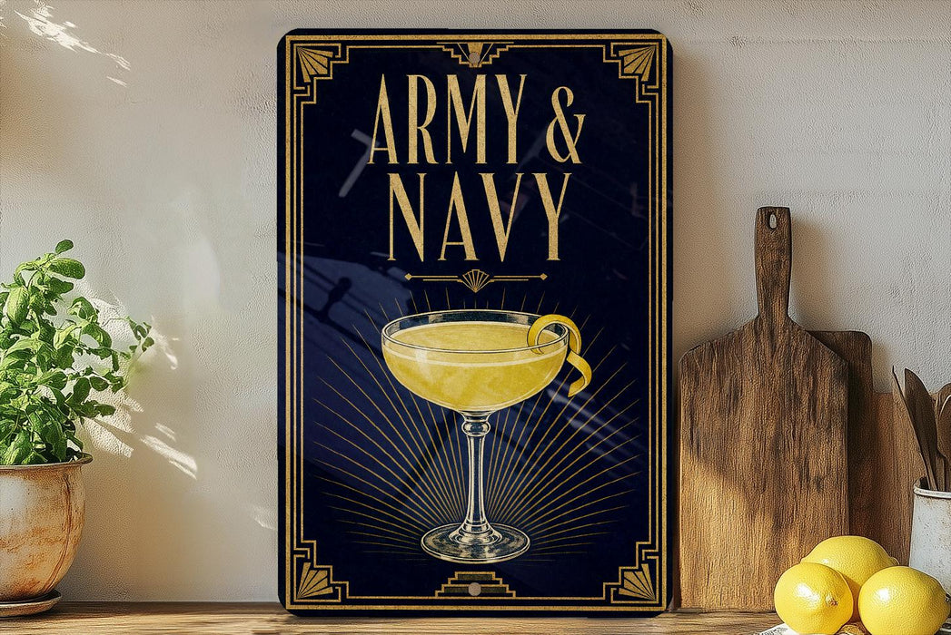 A framed poster with the text "ARMY & NAVY" and an illustration of a cocktail glass with a lemon twist, placed on a wooden shelf next to a cutting board and a potted plant.
