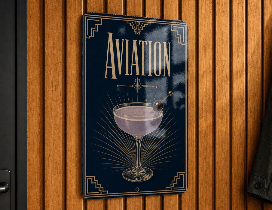 A sign with the word "AVIATION" prominently displayed, featuring an illustration of a martini glass with a cherry on top.