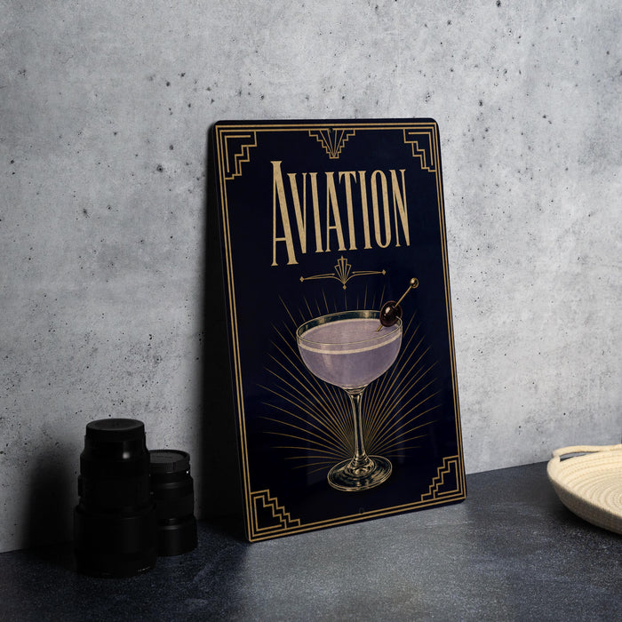 a framed poster with an illustration of a cocktail glass and the word "AVIATION" prominently displayed on it.