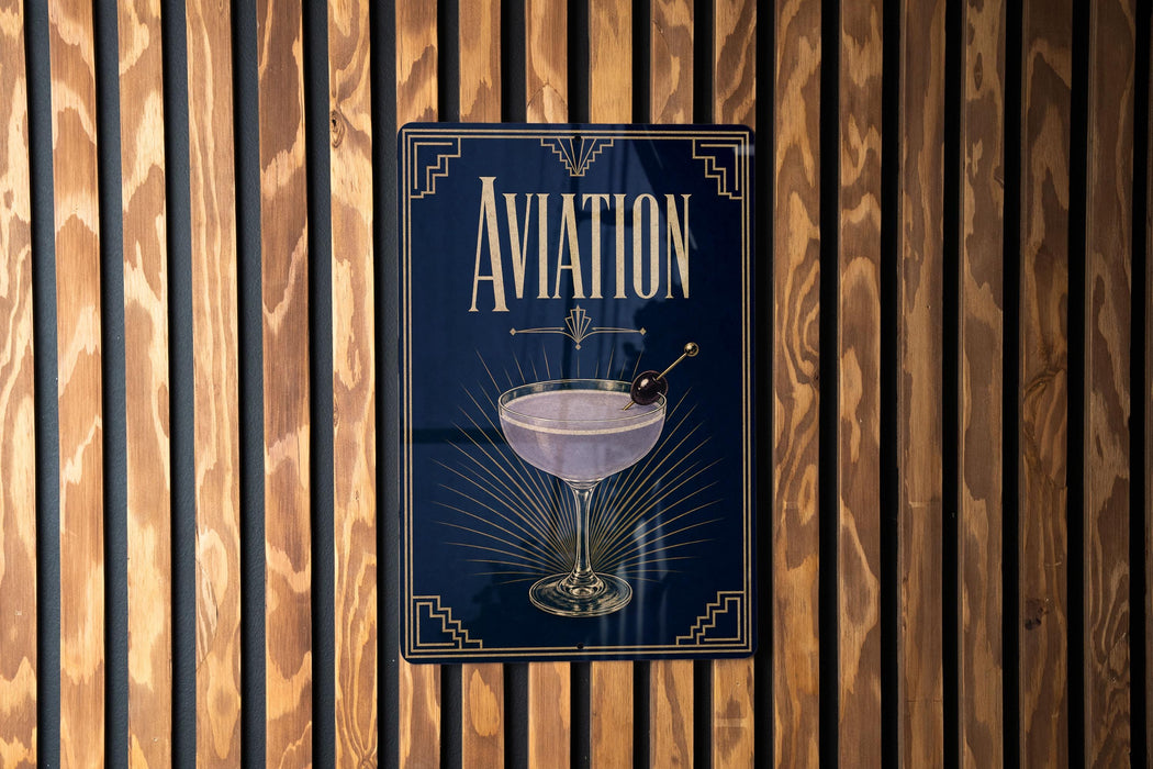 a sign with the word "AVIATION" prominently displayed, along with an illustration of a martini glass.