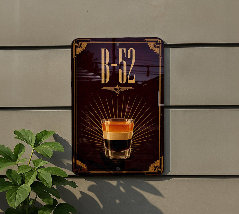 a sign with the number "B-52" and an illustration of a layered drink, likely a cocktail or mixed drink, with a glass containing the layered components.