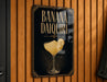 A sign for a banana daiquiri cocktail is displayed on a wooden wall.