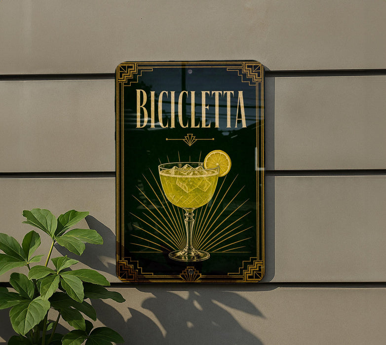 a sign for a cocktail called "Bicyclette" with a glass illustration and a lemon slice.