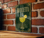 a sign with the word "BIICLETA" on it, which is mounted on a brick wall.