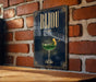 A poster with the word "Bjou" displayed prominently, featuring a glass of green liquid and a lemon slice.