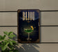 A sign for a bar called "Bijou" with a glass of green cocktail and a lemon on the side, mounted on a wall.