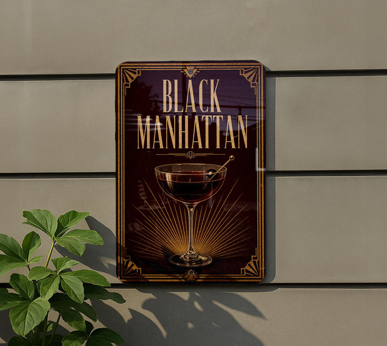 A sign for "Black Manhattan" cocktail, featuring a glass of Manhattan cocktail and decorative elements.