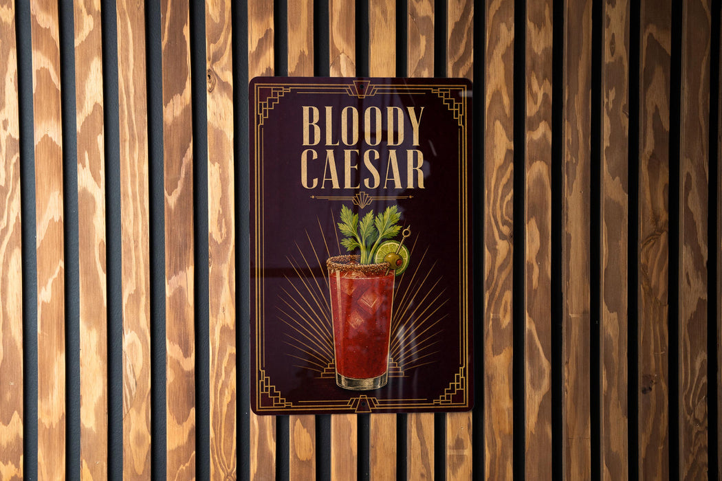 A sign for a Bloody Caesar cocktail is displayed against a wooden wall.