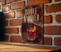 A sign with the text "BOULE VARDIER" and an illustration of a cocktail is displayed on a brick wall.