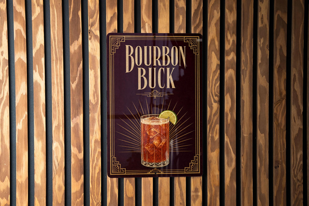 A sign for "Bourbon Buck", featuring an illustration of a glass of amber-colored liquid with a lime wedge.