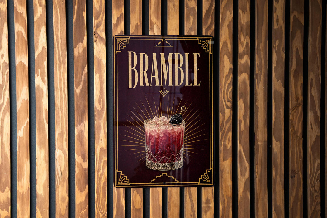 A sign for "Bramble" cocktail is displayed on a wooden wall.