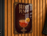 A sign for "Brandy Punch" is hanging on a wooden wall.