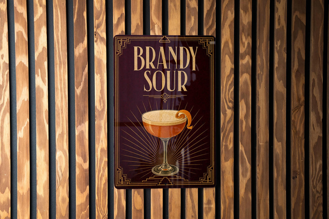 A sign for "Bandy Sour" cocktail is displayed on a wooden wall.