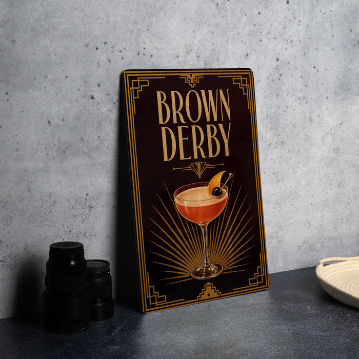 A framed poster with the title "Brown Derby" displayed prominently, featuring an illustration of a cocktail glass with a garnish.