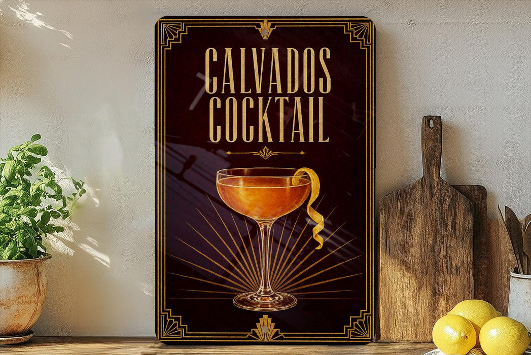a framed advertisement for a cocktail called "Calvados Cocktail" with a glass illustration and decorative elements.