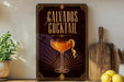 a framed advertisement for a cocktail called "Calvados Cocktail" with a glass illustration and decorative elements.