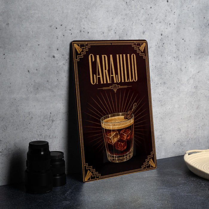 A framed advertisement for Carajillo, featuring an illustration of a cocktail with ice cubes.