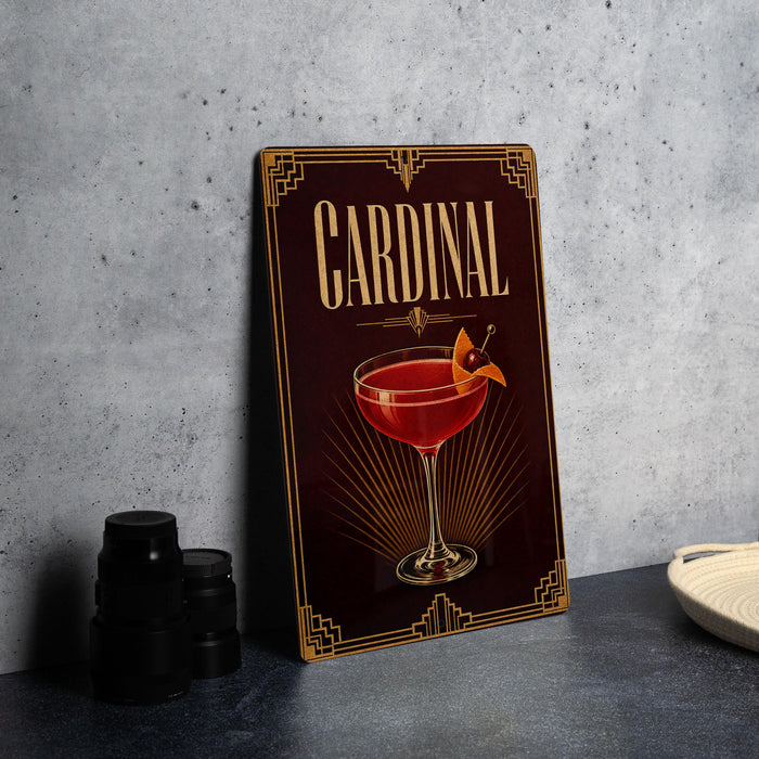 A decorative sign for a "Cardinal" cocktail, featuring an illustration of a martini glass with a garnish.