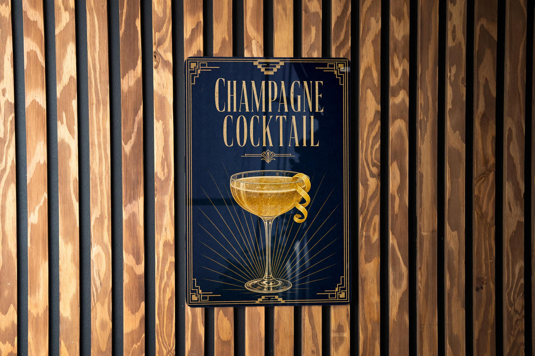 A poster advertising a champagne cocktail is displayed on a wooden wall.
