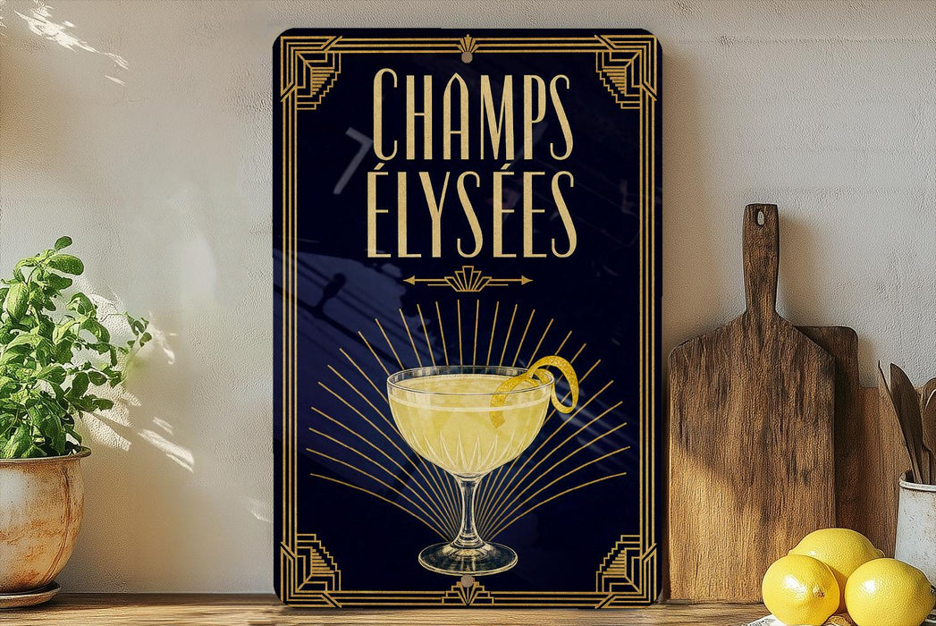 A framed poster with the text "CHAMPS ELYSEES" and an illustration of a cocktail glass with a lemon twist.